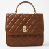 Brown quilted leather handbag with a top handle and gold-tone clasped closure.