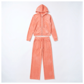 Peach velour zip-up hoodie with front pockets laid flat on white background, matching drawstring pants below it, casual loungewear set