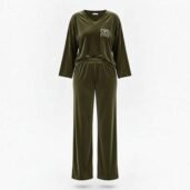 Olive green velour tracksuit set with a V-neck top and matching pants; small white logo on the chest.