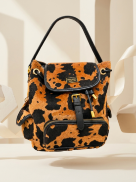 Leopard-print orange and black handbag with black strap and gold hardware, front zipper pocket visible.