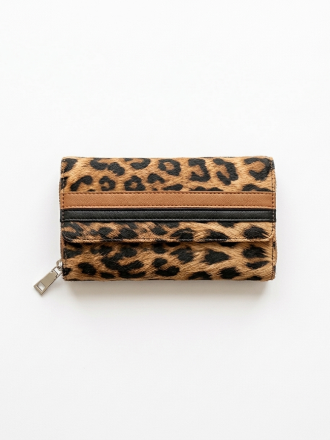 Leopard print wallet with a zipper and brown trim on a light background
