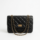 Black quilted leather handbag with gold chain strap and rectangular turn-lock clasp.