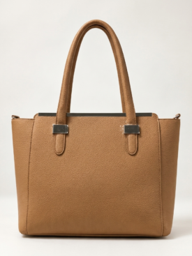 Tan pebbled leather tote bag with two handles and silver hardware on a light background, front view.