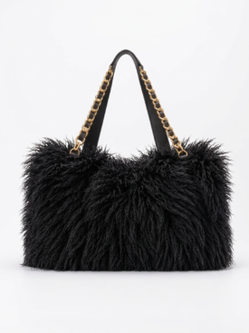 Black shaggy tote bag with gold chain straps on a white background, showing a plush textured exterior and black handles.