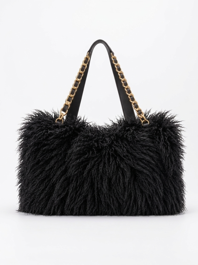bW3z1EZpfaV3hBfNPgP4_X Black shaggy tote bag with gold chain straps on a white background, showing a plush textured exterior and black handles.