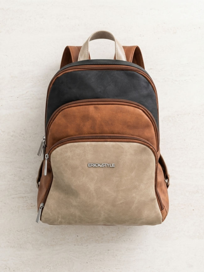 backpack 2 Color-block backpack with beige front pocket, brown middle panel, black top panel, and metal zippers; ERICK STYLE logo on front.