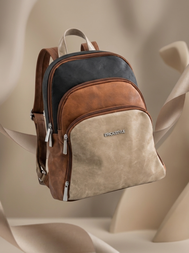 backpack4 Erickstyle leather backpack with beige front, brown sides, and dark gray top; multiple zip pockets.