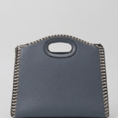 Blue pebbled leather handbag with silver chain trim and an oval built-in handle.