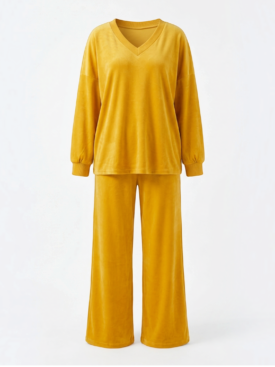 Mustard yellow velour tracksuit on a mannequin: V-neck sweatshirt with ribbed cuffs and matching wide-leg pants.