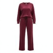 Burgundy velour tracksuit with studded shoulders, a long-sleeve top and matching drawstring pants.