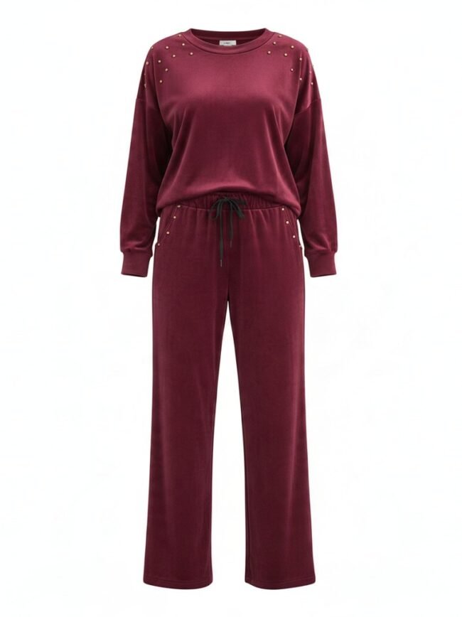 Ghost Mannequin-36f38dce-4870-4cde-b657-5f04af374969 Burgundy velour tracksuit with studded shoulders, a long-sleeve top and matching drawstring pants.