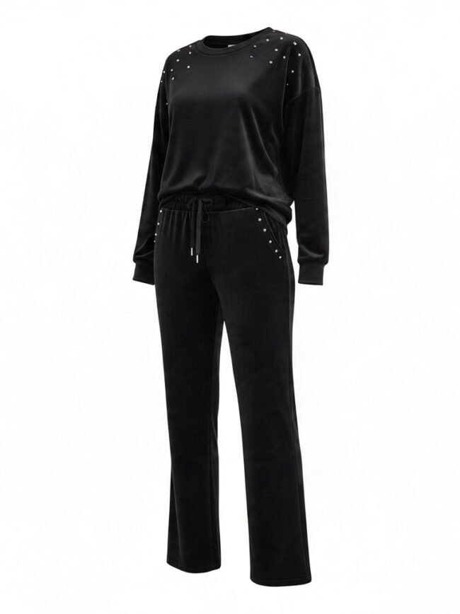 Black velour tracksuit with stud embellishments on shoulders and pockets, drawstring waist.
