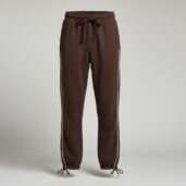 Brown jogger pants with drawstring waist and white side stripes, gathered cuffs with ties.