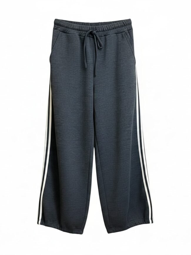 Dark gray athletic pants with a drawstring waistband and white side stripes, full-length joggers designed for sportswear