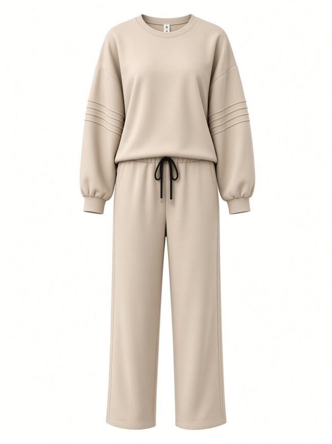 Beige oversized sweatshirt with drop shoulders and matching wide-leg drawstring pants set on a white background