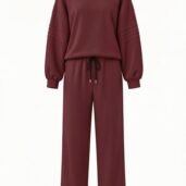 Maroon loungewear set with a loose sweatshirt and wide-leg drawstring pants.
