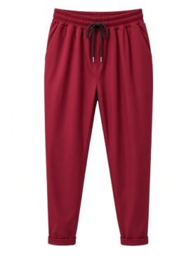 Maroon jogger pants with an elastic waistband and black drawstring, tapered legs, and cuffed ankles on a white background.