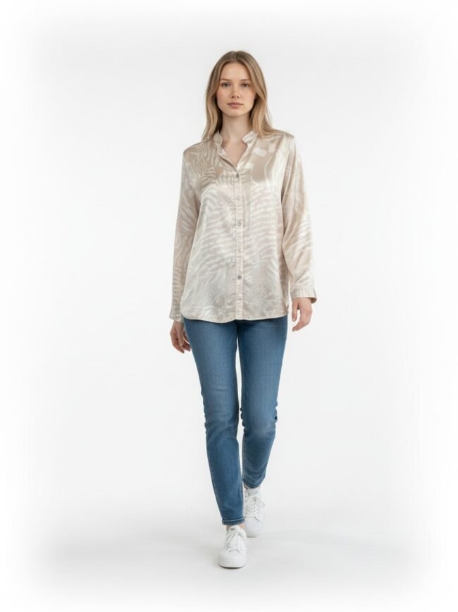 Full-body shot of a woman wearing a beige patterned button-down shirt, blue jeans, and white sneakers against a white backdrop.”] }? Wait ensure correct JSON. I included closing quote and unicode. Let's craft proper.