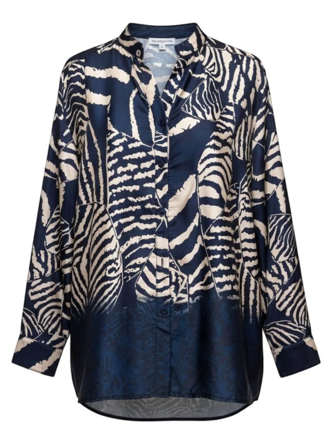 Navy blue button-down shirt with a bold cream zebra pattern, long sleeves, and curved hem.