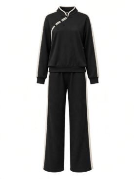Black matching tracksuit: long-sleeve top with white piping and Chinese knot buttons, paired with wide-leg pants with white side stripes.